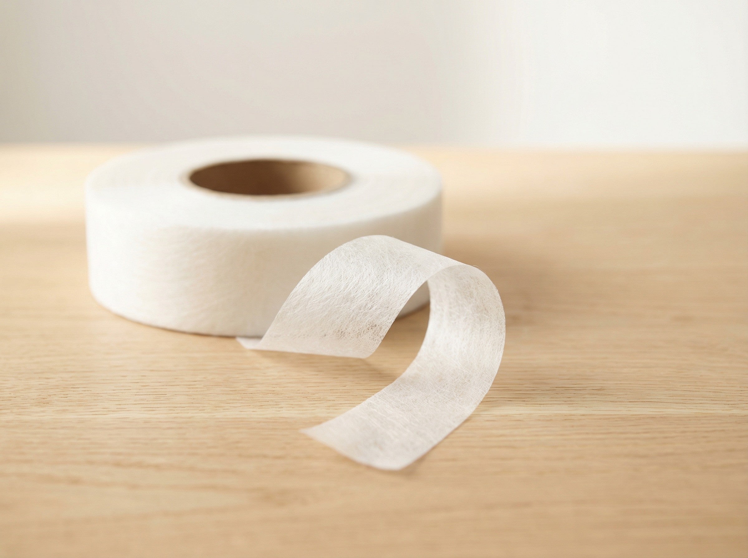 Iron-On Hot Melt Adhesive Hem Tape For Garment.